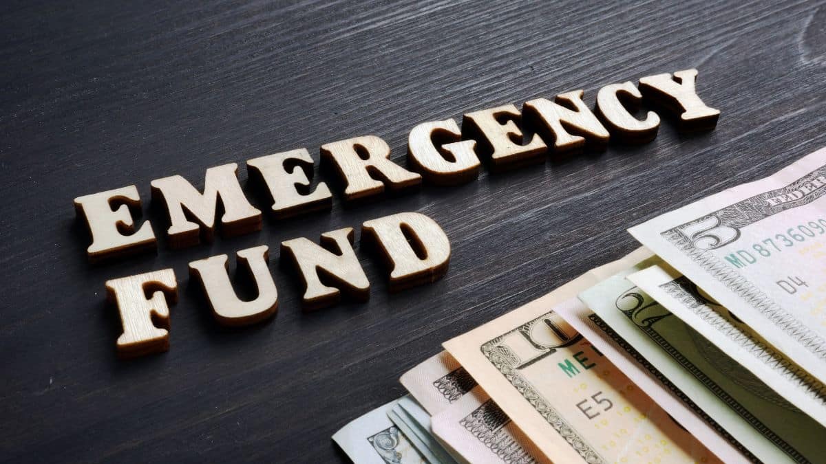 a stack of money and wooden letters